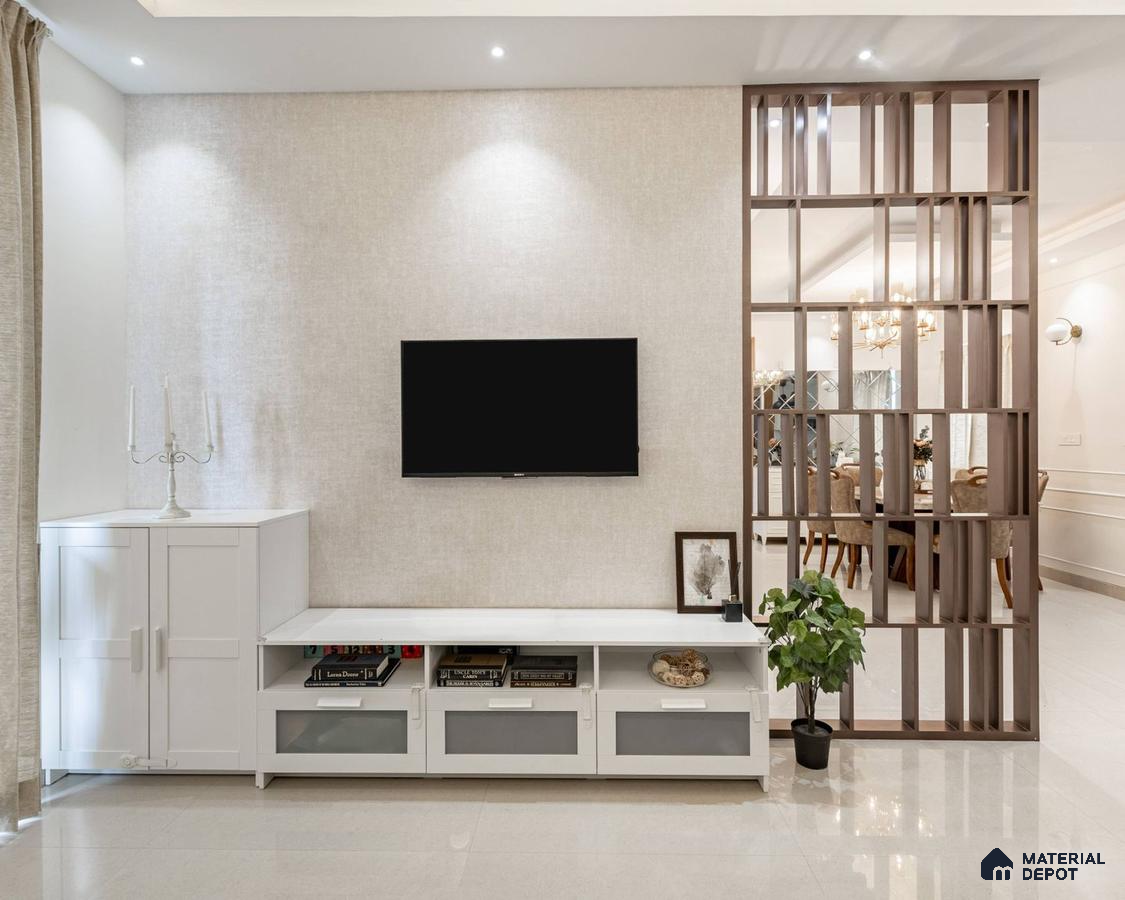 A spacious living room with a TV and a bookshelf
