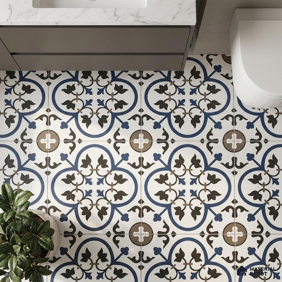 Modern bathroom with blue and brown moroccan patterned floor tiles and marble countertop vanity
