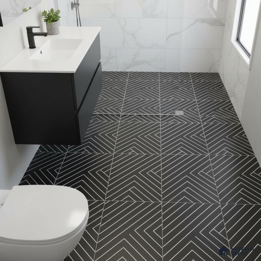 Modern bathroom with black geometric floor tiles and marble-look wall tiles