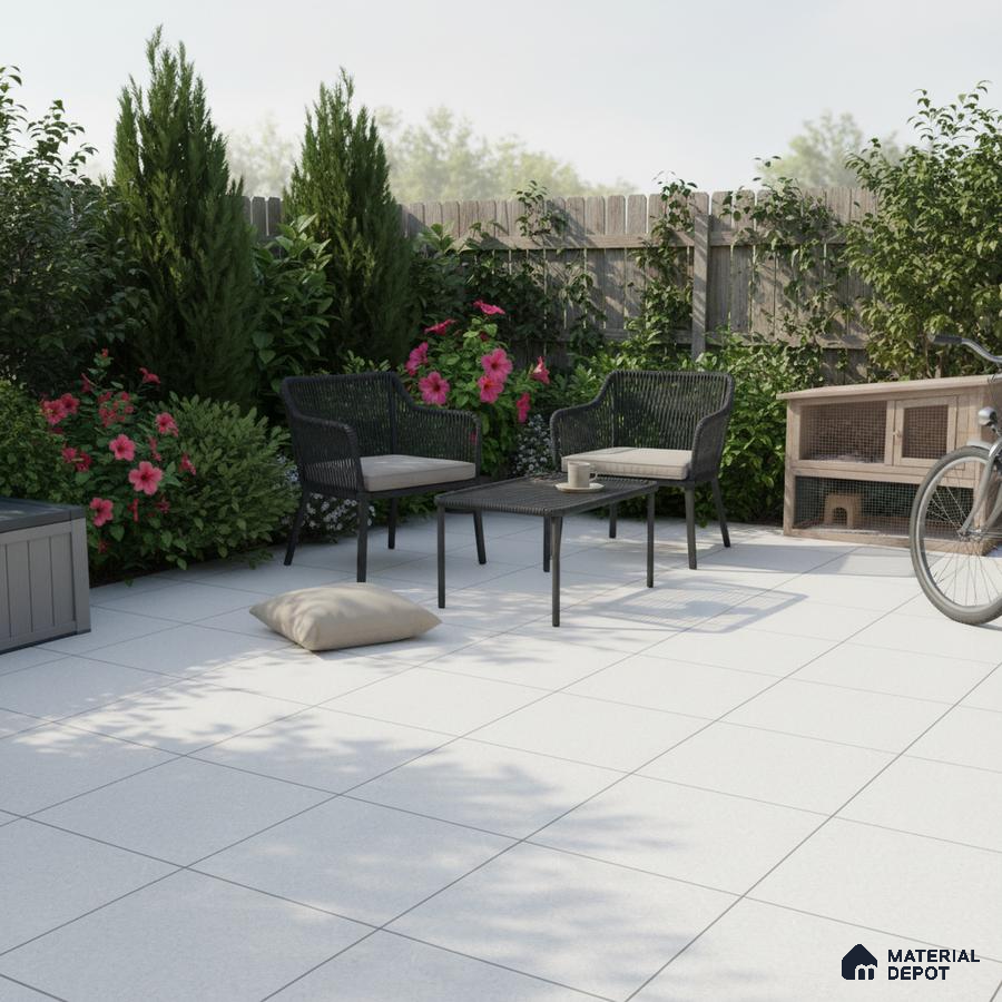 Modern outdoor patio with white matte floor tiles and black wicker furniture