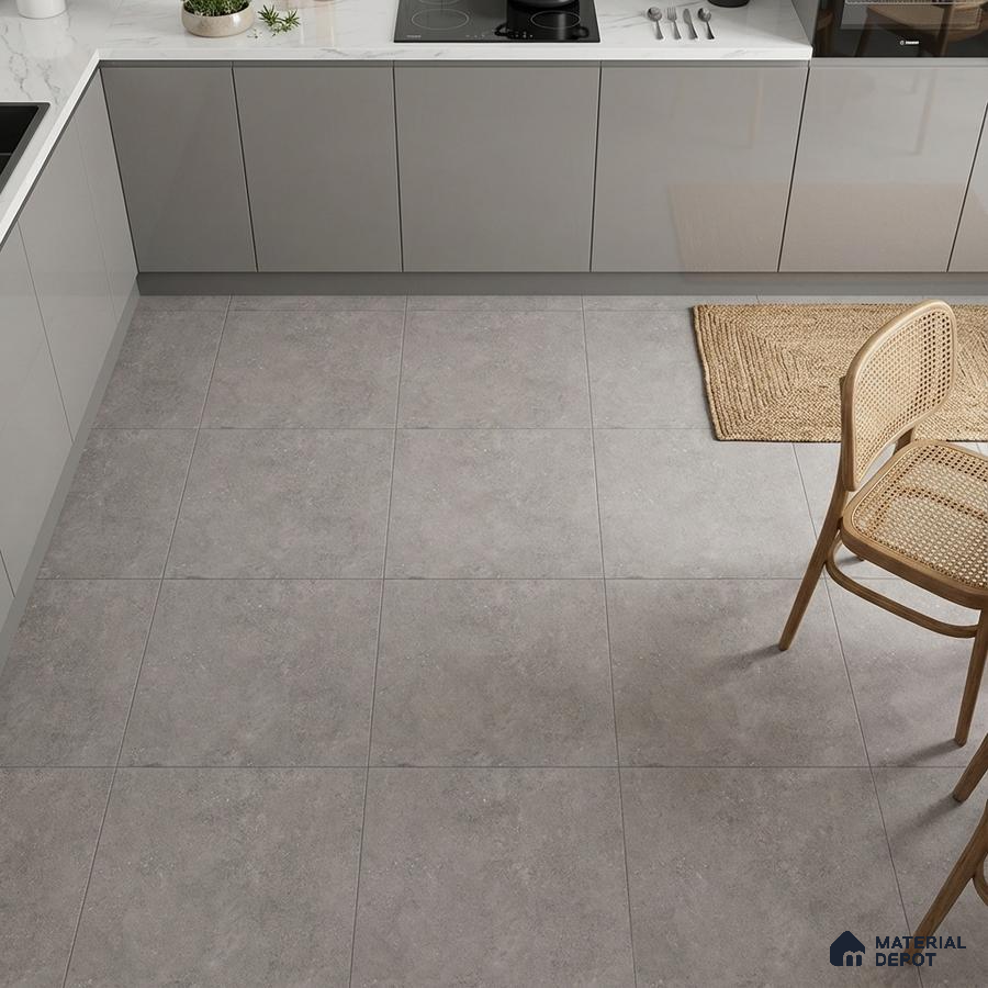 Minimalist kitchen with grey matte laminate cabinets and light grey stone-look floor tiles