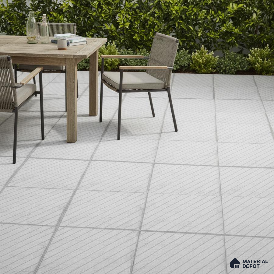 Minimalist outdoor patio with light grey diagonal line floor tiles and natural wood dining set
