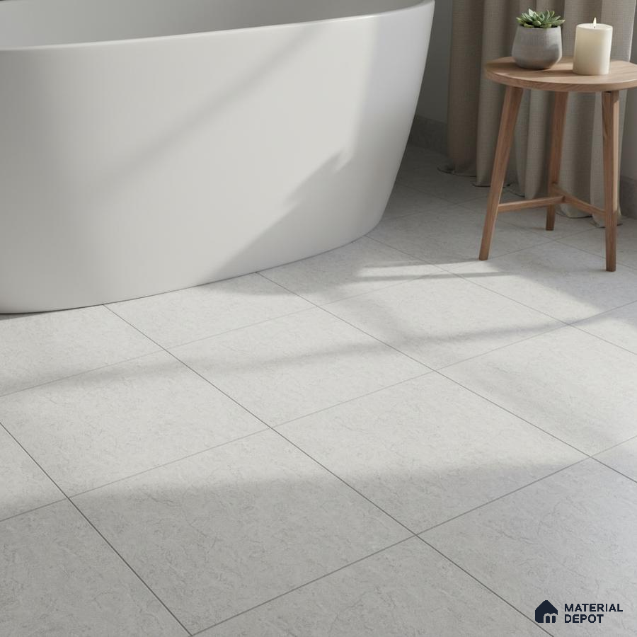Minimalist bathroom with matte white bathtub and light grey stone-look floor tiles