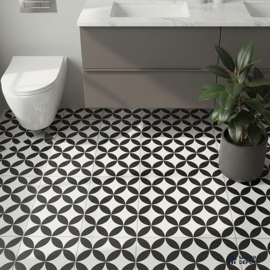 Modern bathroom with geometric black-and-white patterned floor tiles and grey vanity