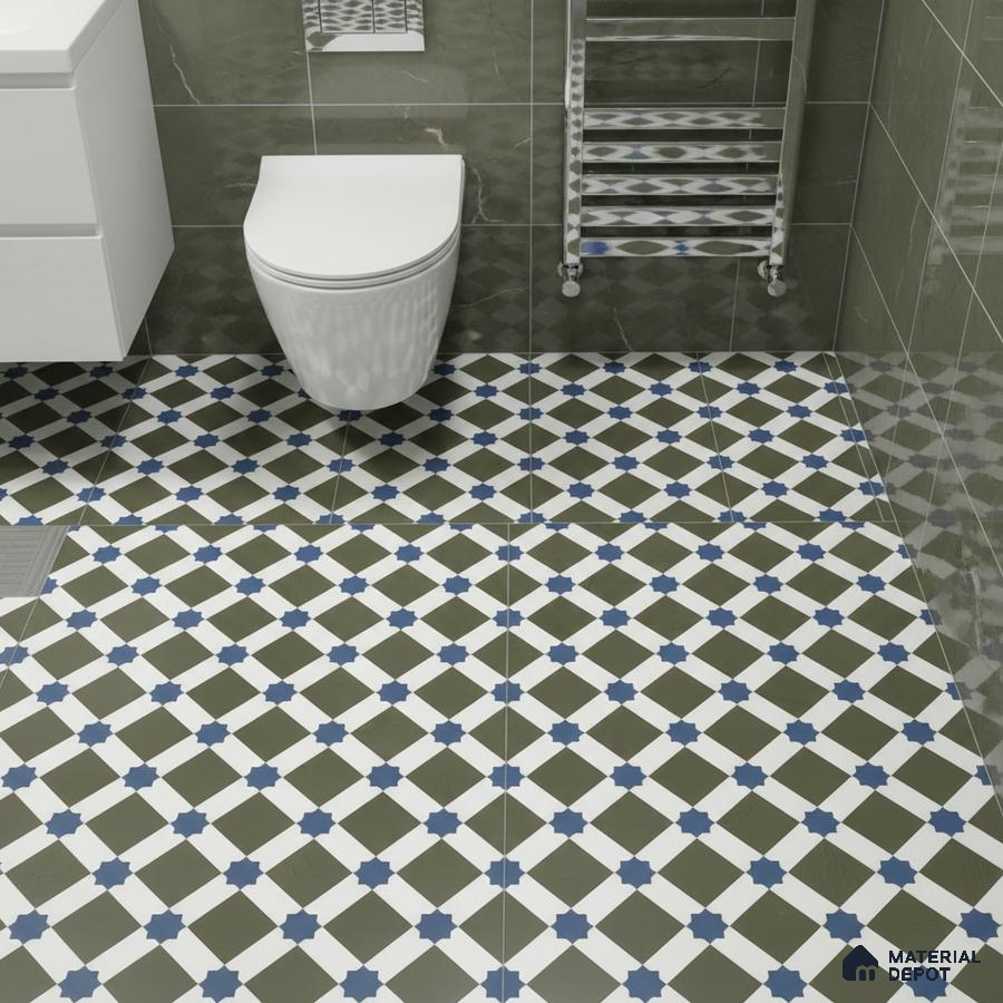 Modern bathroom with olive green marble wall tiles and blue geometric patterned floor tiles