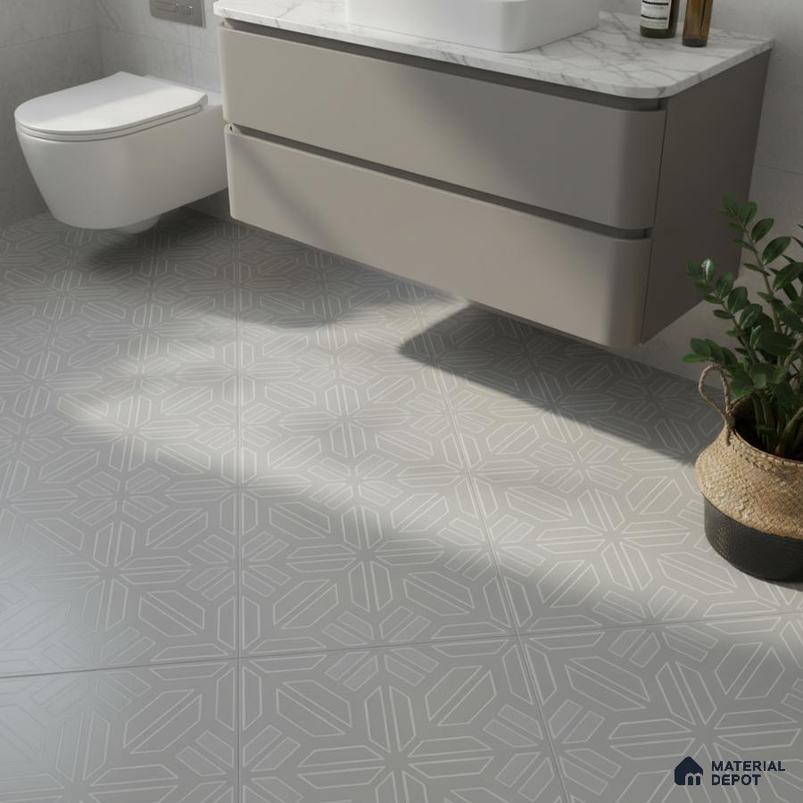 Modern bathroom with geometric patterned grey floor tiles and marble countertop vanity