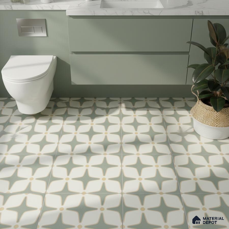 Modern bathroom with sage green laminate vanity and geometric patterned floor tiles