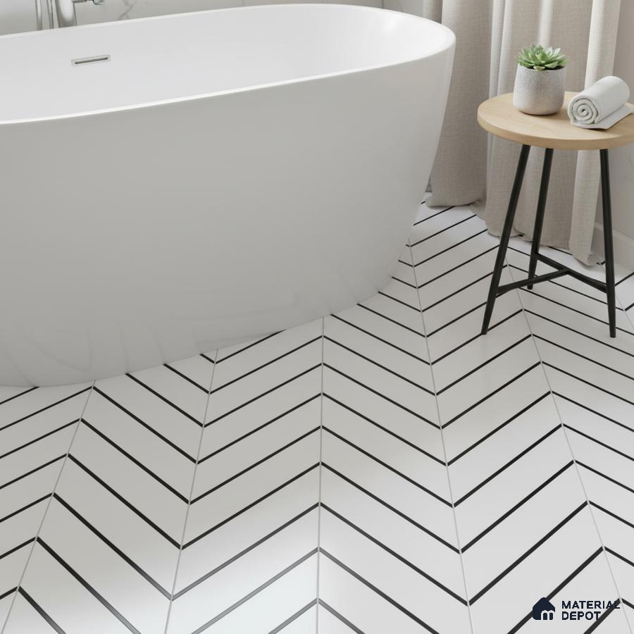Minimalist bathroom with white chevron floor tiles and freestanding tub