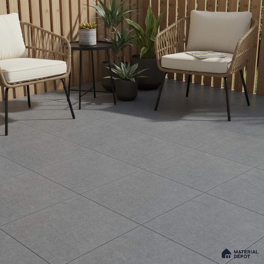 Scandinavian outdoor seating with grey stone-look floor tiles and natural wood louver panels