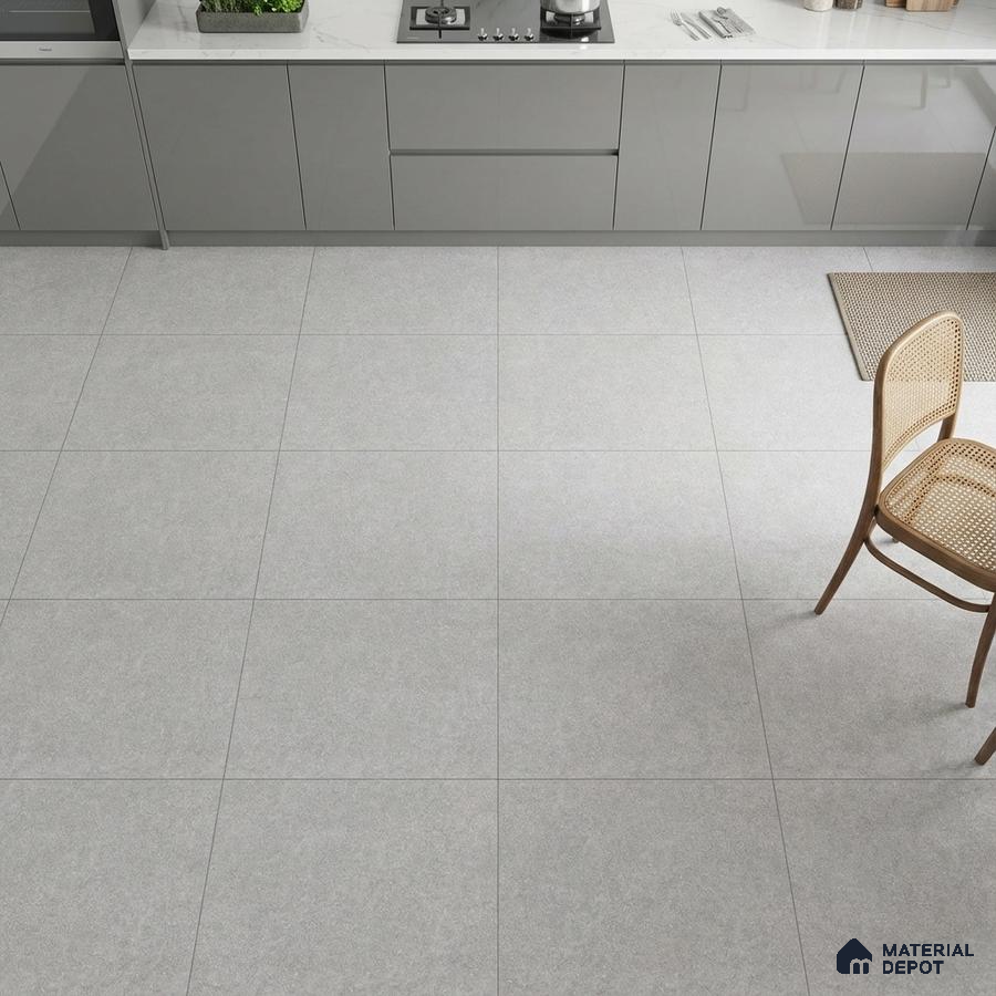 Modern kitchen with grey high gloss laminate cabinets, white marble-look quartz countertop, and light grey matte floor tiles
