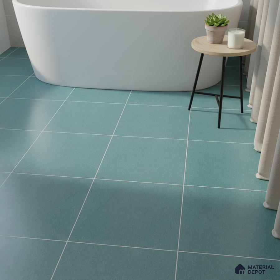 Minimalist bathroom with teal blue matte floor tiles and freestanding tub