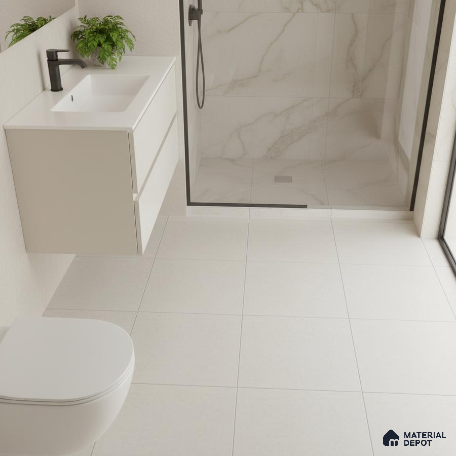 Minimalist bathroom with white matte floor tiles and marble-look wall tiles in shower