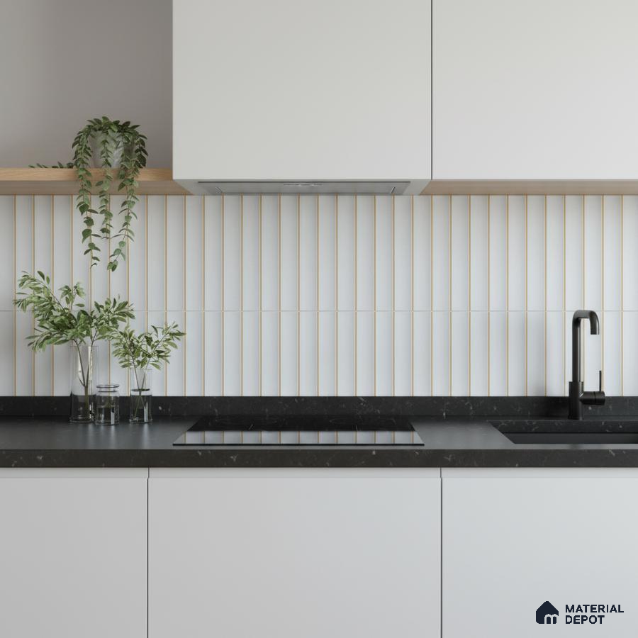 Minimalist kitchen with frosty white laminate cabinets, black quartz countertop, and vertical white kitkat backsplash tiles
