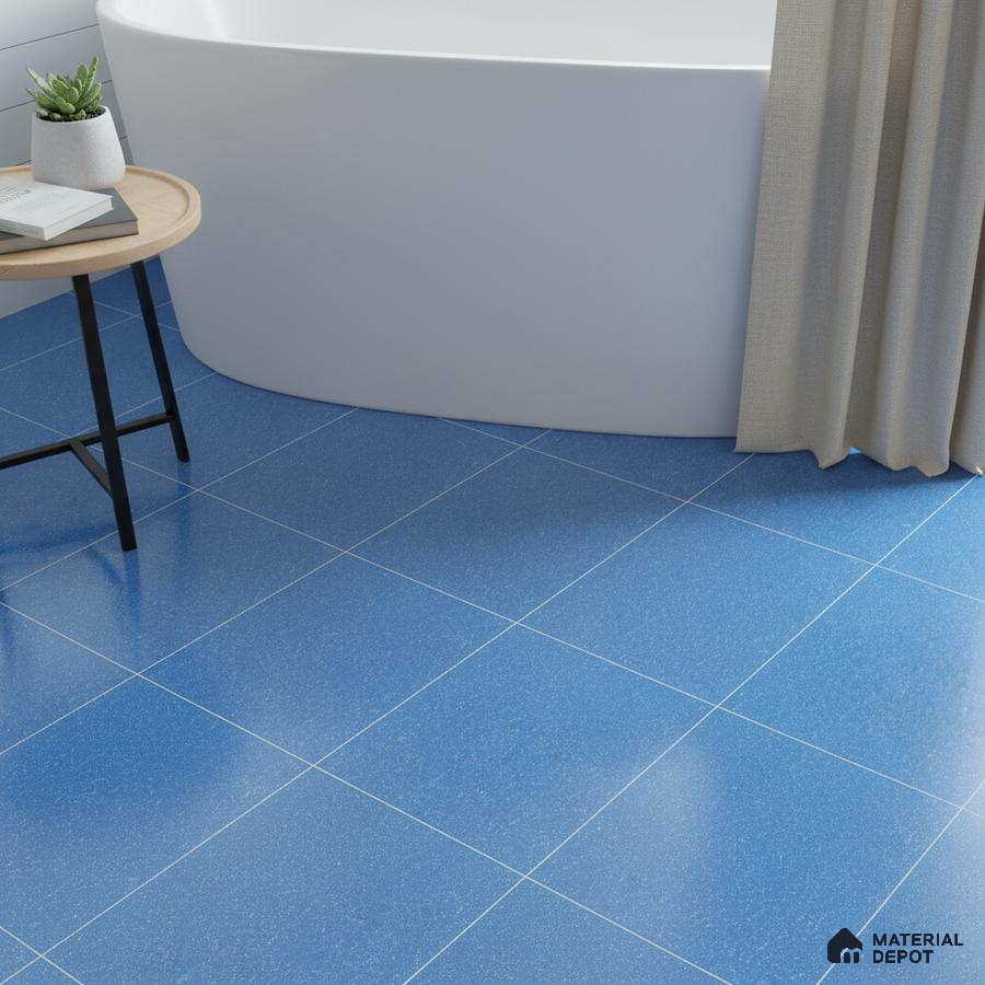 Modern bathroom with blue floor tiles and freestanding tub