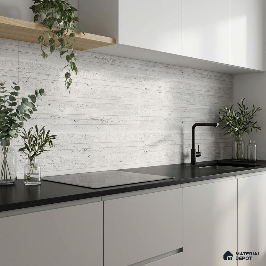 Minimalist kitchen with matte white laminate cabinets, black quartz countertop, and light grey stone-look backsplash tile