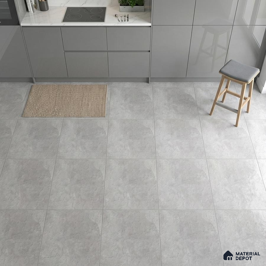 Modern kitchen with grey high gloss laminate cabinets and light grey stone-look floor tiles