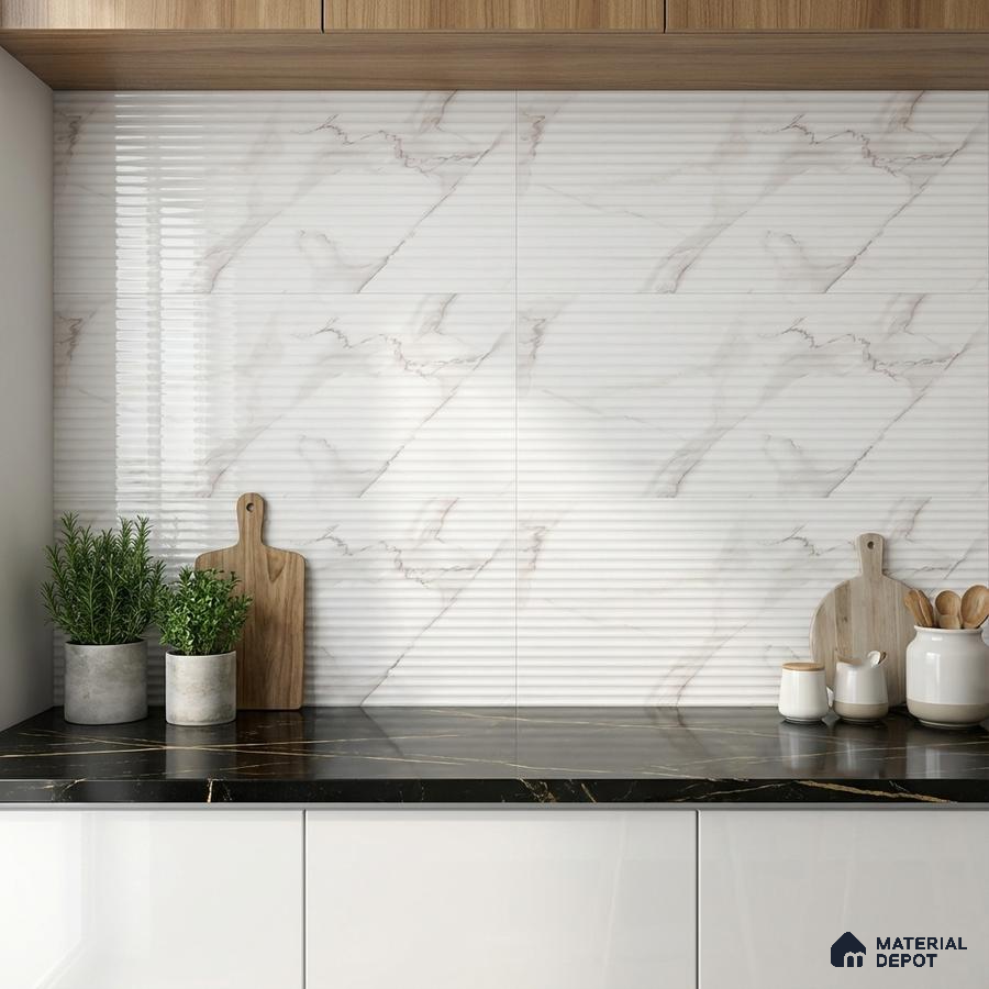 Modern kitchen with ribbed marble-look wall tiles, black marble countertop, and white laminate cabinets