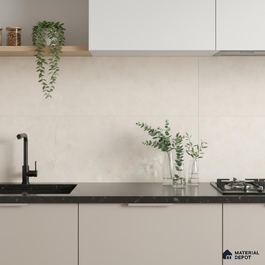 Minimalist kitchen with matte beige laminate cabinets, black quartz countertop, and off-white stone look backsplash tile