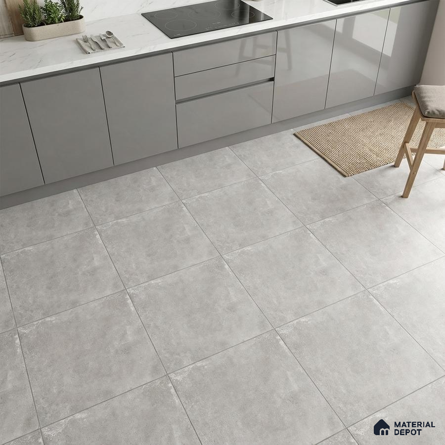Modern kitchen with grey high gloss laminate cabinets, white marble-look countertop, and light grey stone floor tiles