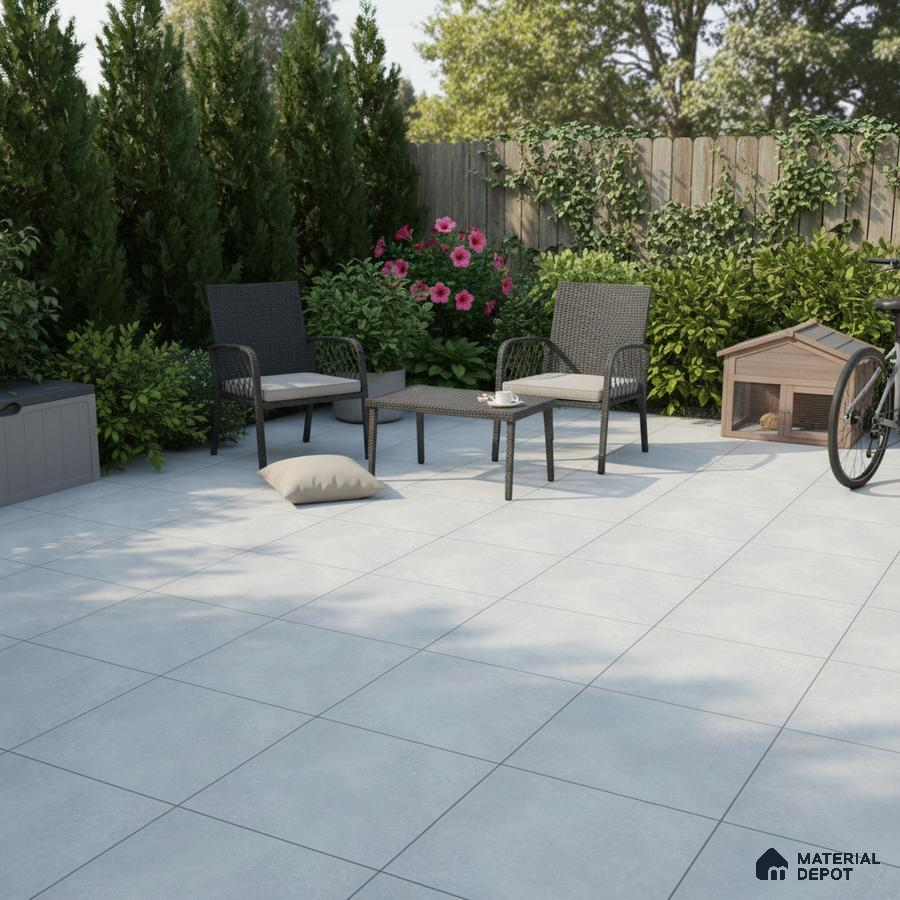 Modern outdoor patio with light grey matte floor tiles and rattan furniture