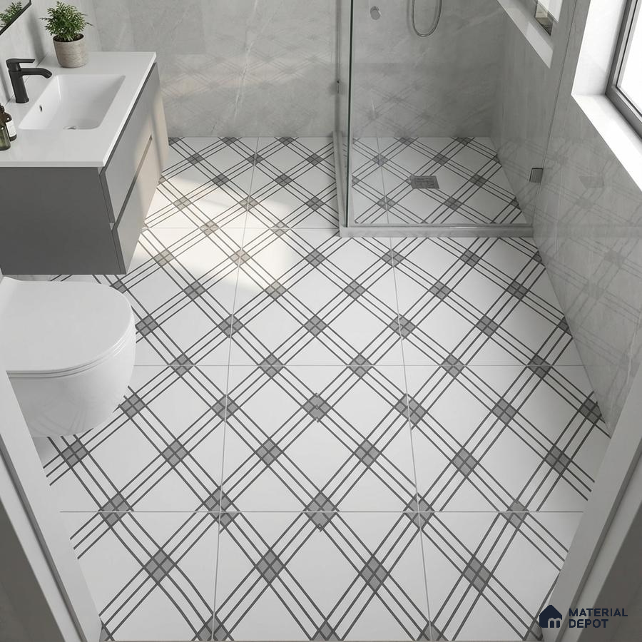 Modern bathroom with grey geometric wall tiles and black-and-white criss-cross patterned floor tiles
