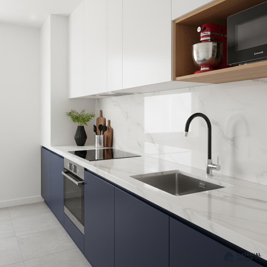 Modern kitchen with navy blue and frosty white laminate, white marble-look backsplash and countertop