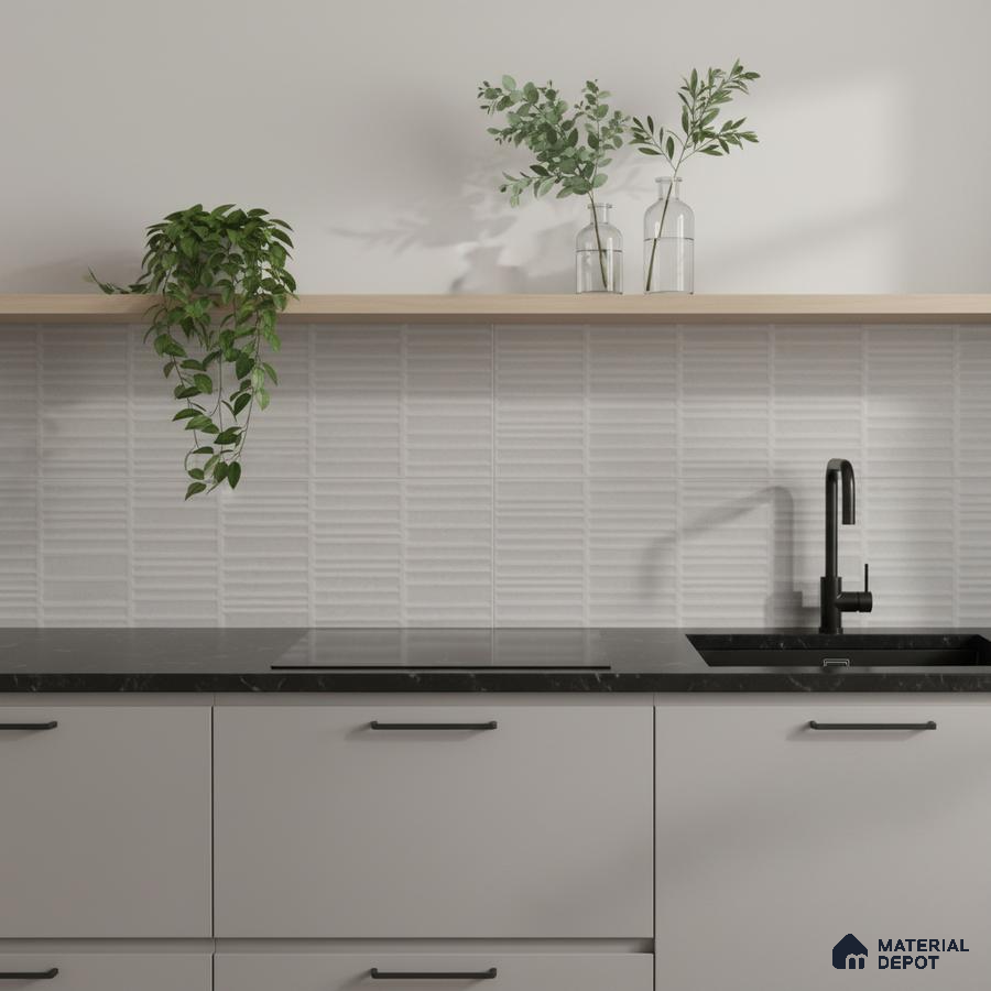 Minimalist kitchen with matte grey laminate cabinets, black marble countertop, and white textured subway backsplash tile