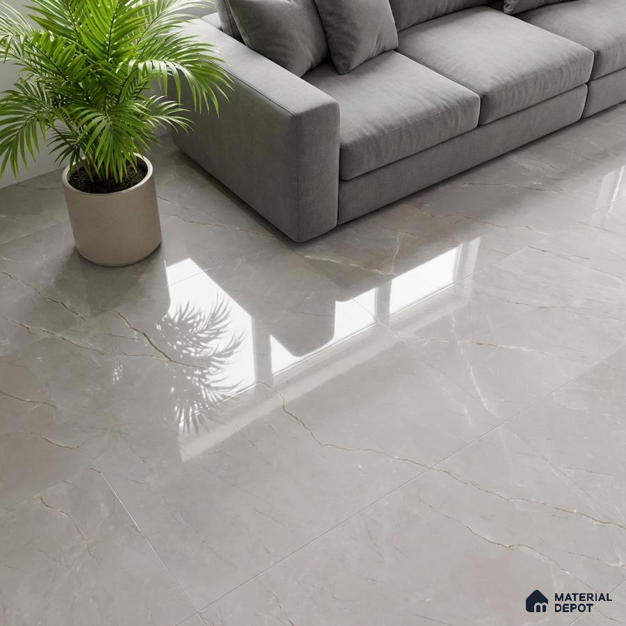 Modern living room with glossy light grey marble-look floor tiles and grey fabric sofa