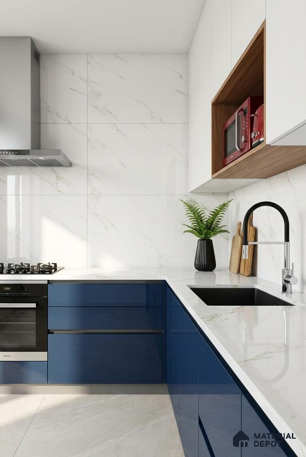 Modern kitchen with blue high gloss laminate, white marble-look backsplash tile, and white quartz countertop