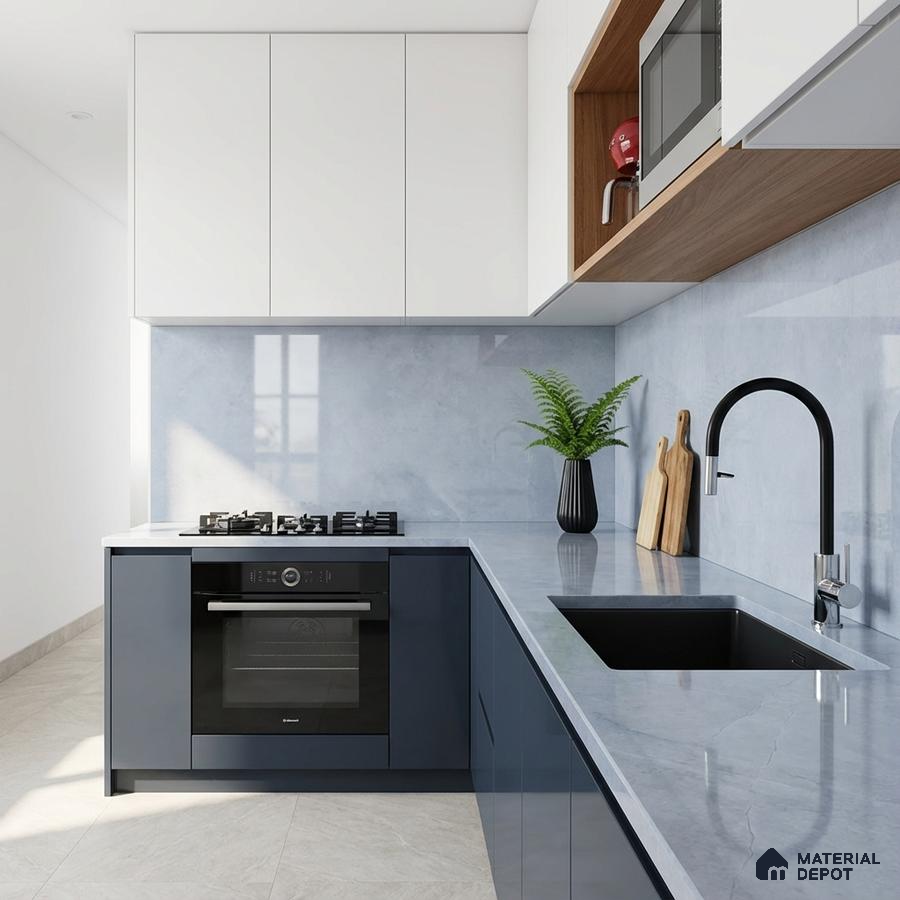 Modern kitchen with white and navy blue laminate, light grey marble-look quartz countertop, and backsplash