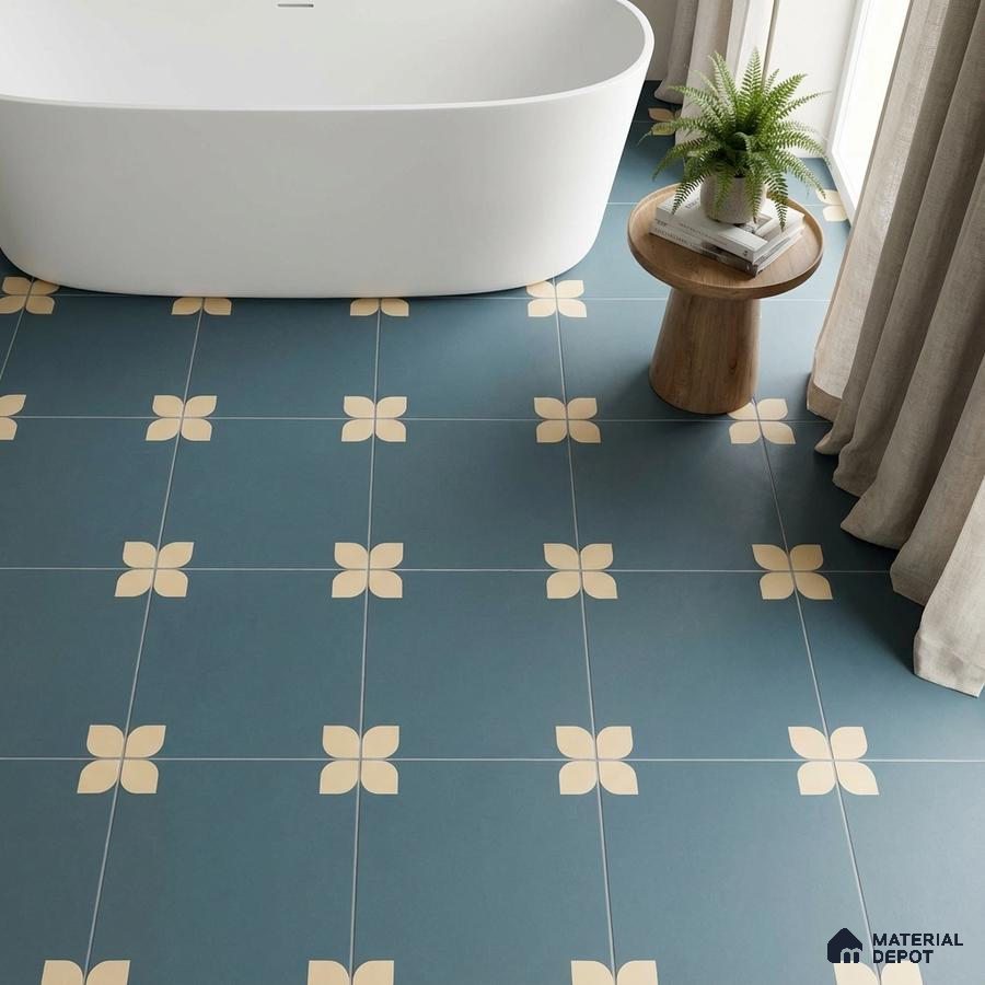 Modern bathroom with blue floral patterned floor tiles and freestanding tub