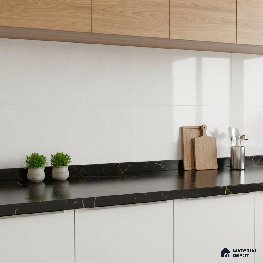 Modern kitchen with light oak laminate cabinets, white wall tiles, and black marble-look quartz countertop