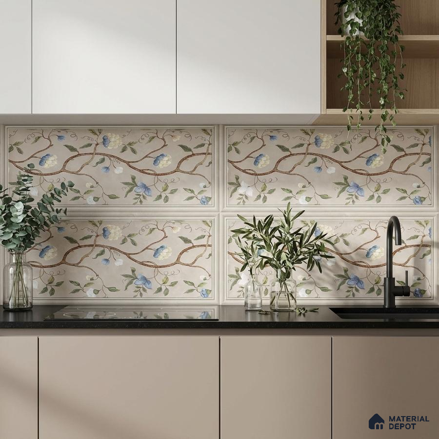 Modern kitchen with floral patterned backsplash tiles, white laminate cabinets, and black quartz countertop