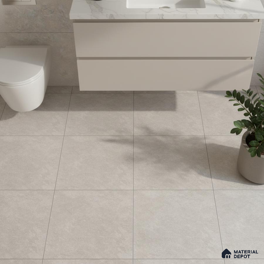 Minimalist bathroom with light grey stone floor tiles and marble-look countertop