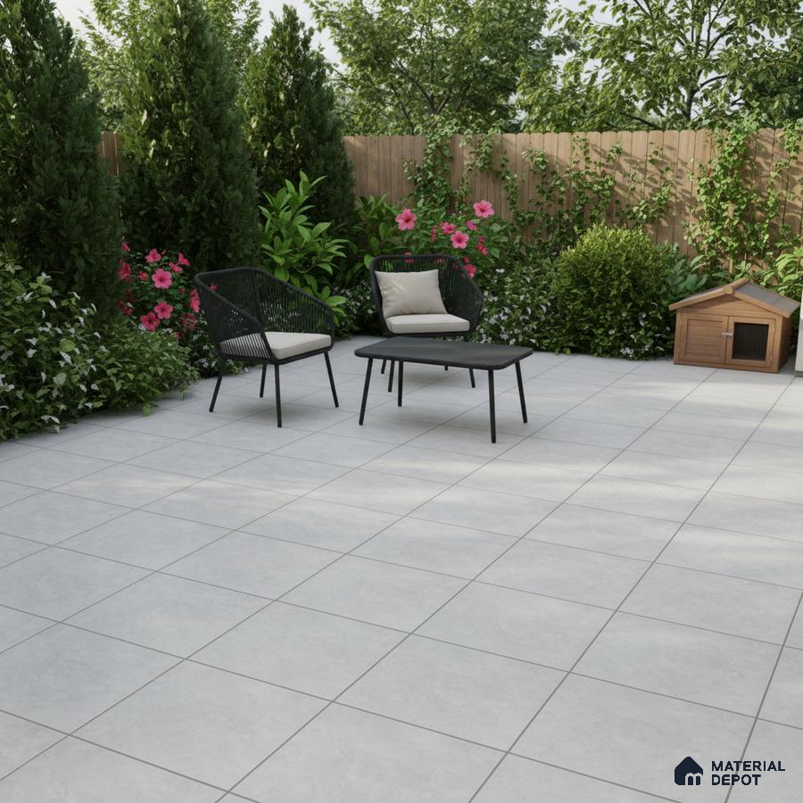 Modern outdoor patio with light grey matte floor tiles and black rope chairs
