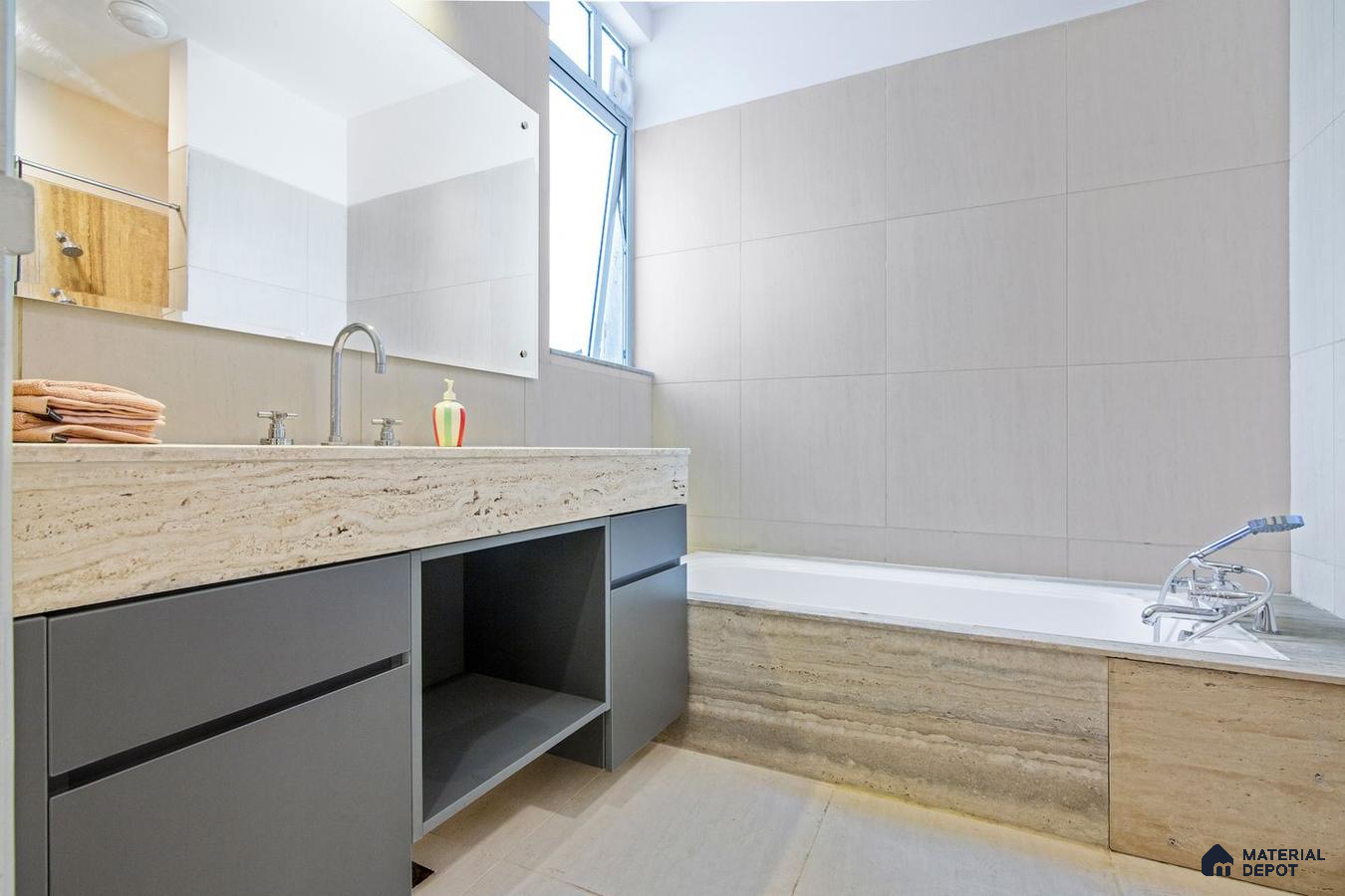 Contemporary bathroom with textured wall tiles.