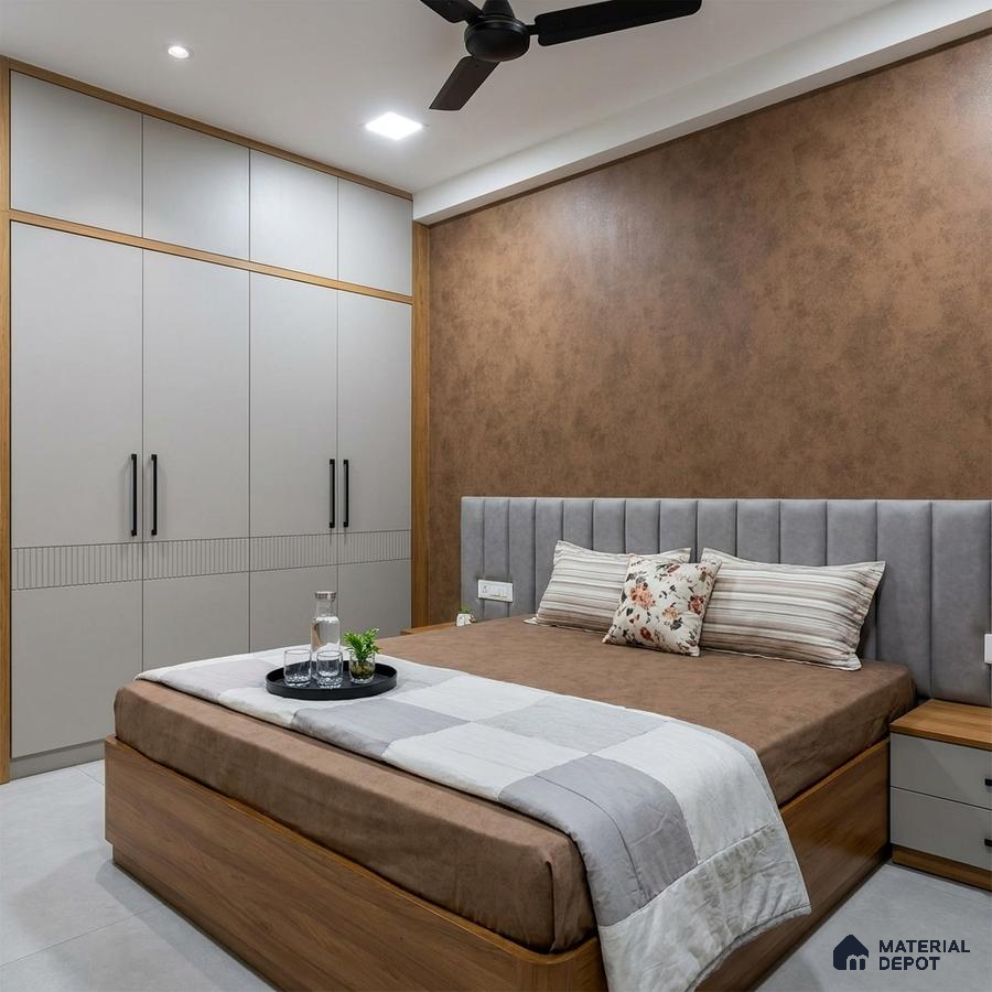 Modern bedroom with matte grey laminate wardrobe, suede upholstered headboard, and brown textured accent wall